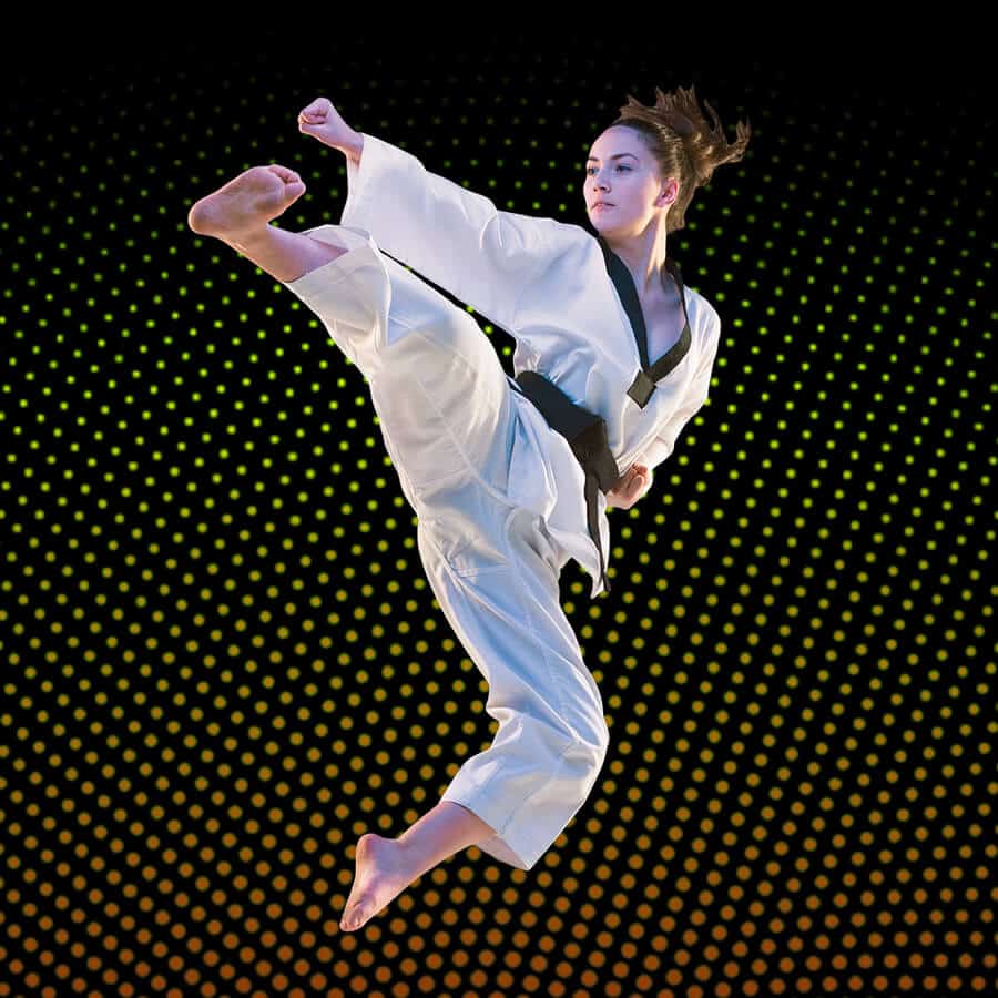 Martial Arts Lessons for Adults in Carrollton TX - Girl Black Belt Jumping High Kick