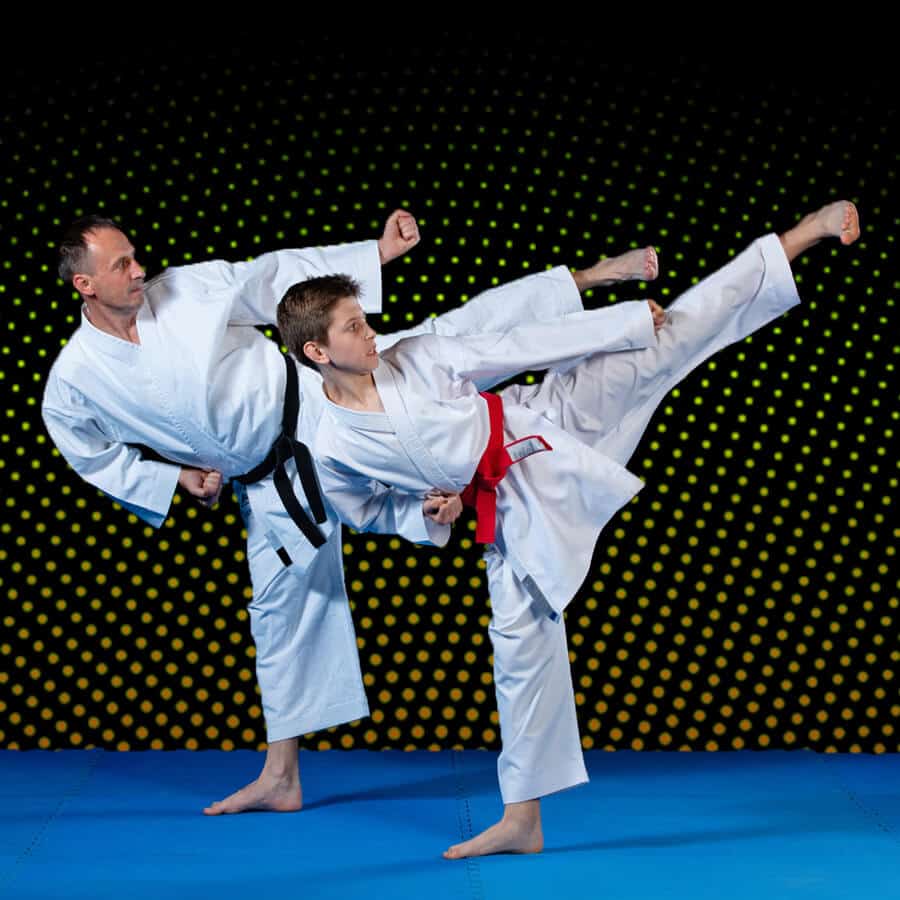 Martial Arts Lessons for Families in Carrollton TX - Dad and Son High Kick